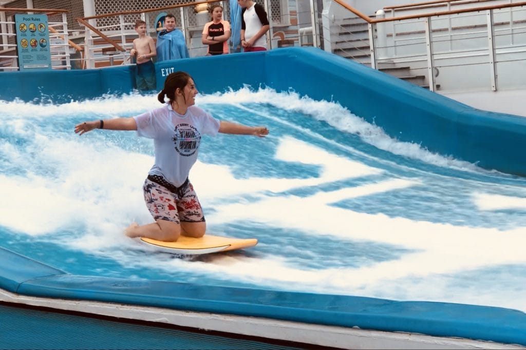 me on the flowrider royal caribbean independence of the seas girl kneeling surfing board shorts