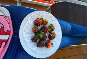 msc meraviglia chocolate strawberries on balcony jeans