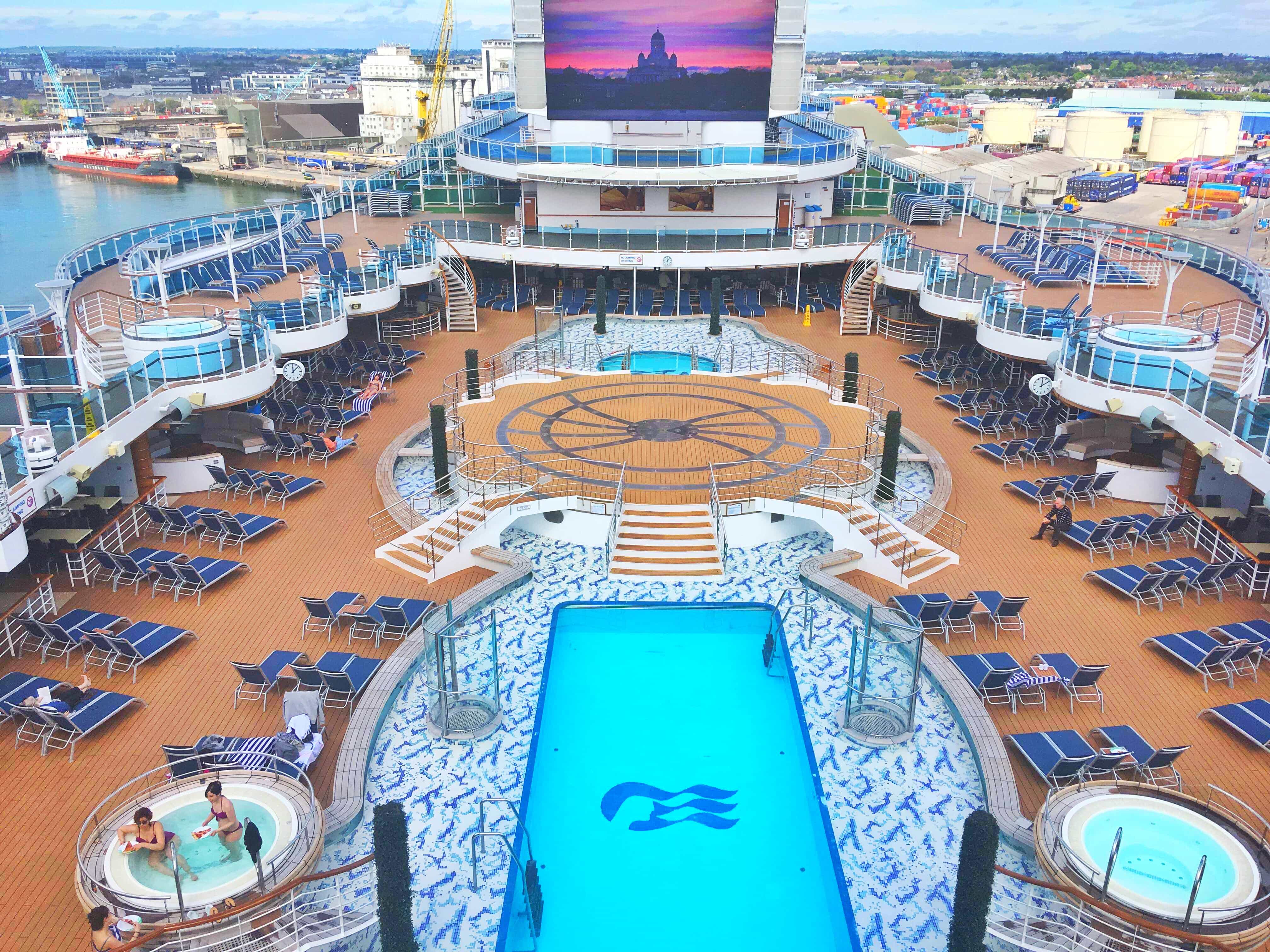 Royal princess british isles cruise top deck swimming pools tv screen hot tubs sun loungers 