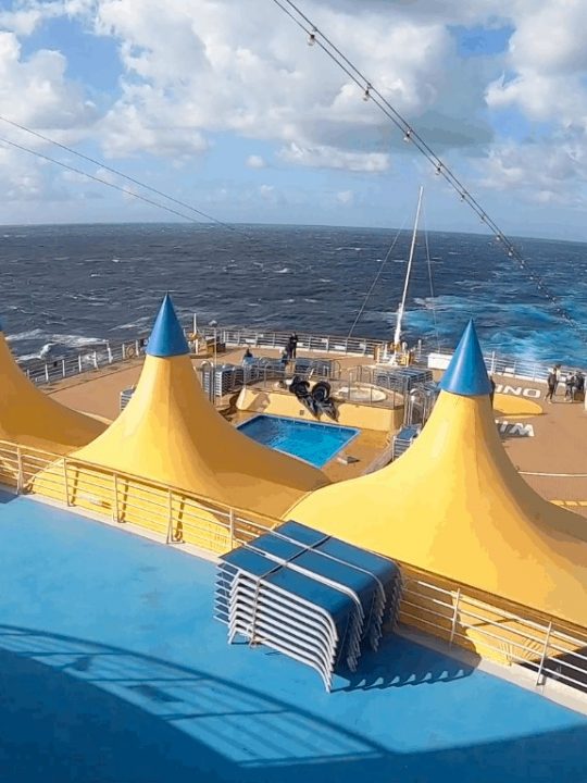 Costa Cruise Yellow Tents Canopies Back of Cruise ship with ocean and horizon
