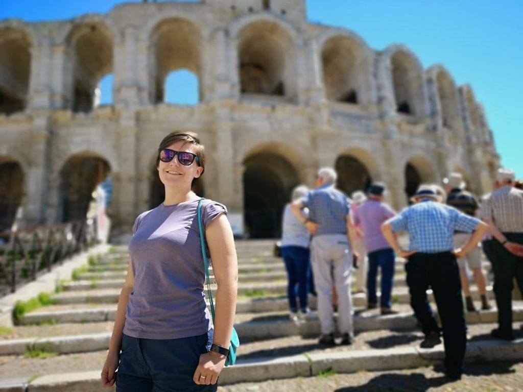 Emerald Waterways Arles Tour amphitheatre girl in sunglasses on steps