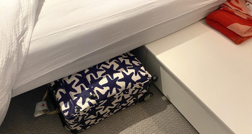 Virgin voyages cabin suitcase under bed
