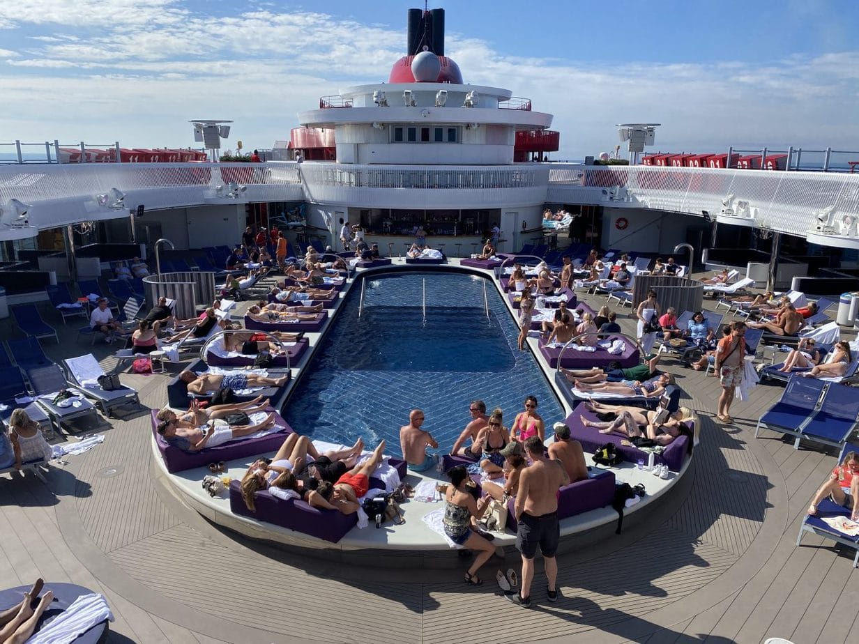 virgin voyages scarlet lady main swimming pool top deck seating