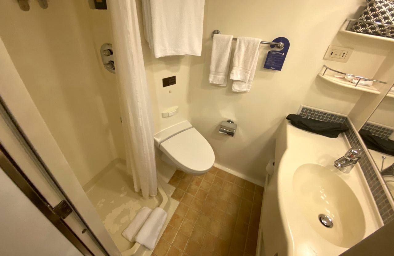 p&o cruises balcony cabin bathroom shower with shower curtain and sink