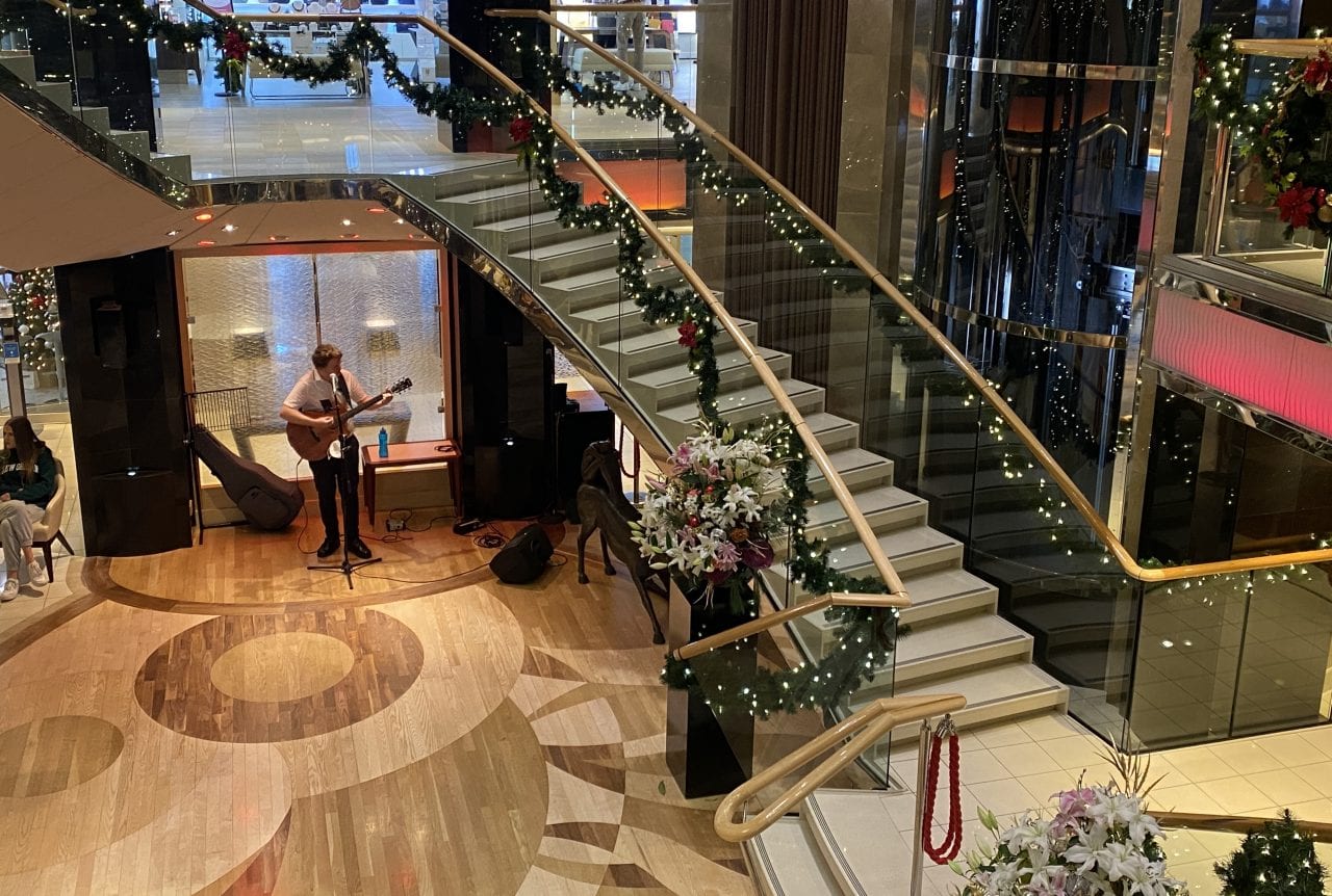 p&o cruises ventura atrium with christmas decorations and live music matt the busker