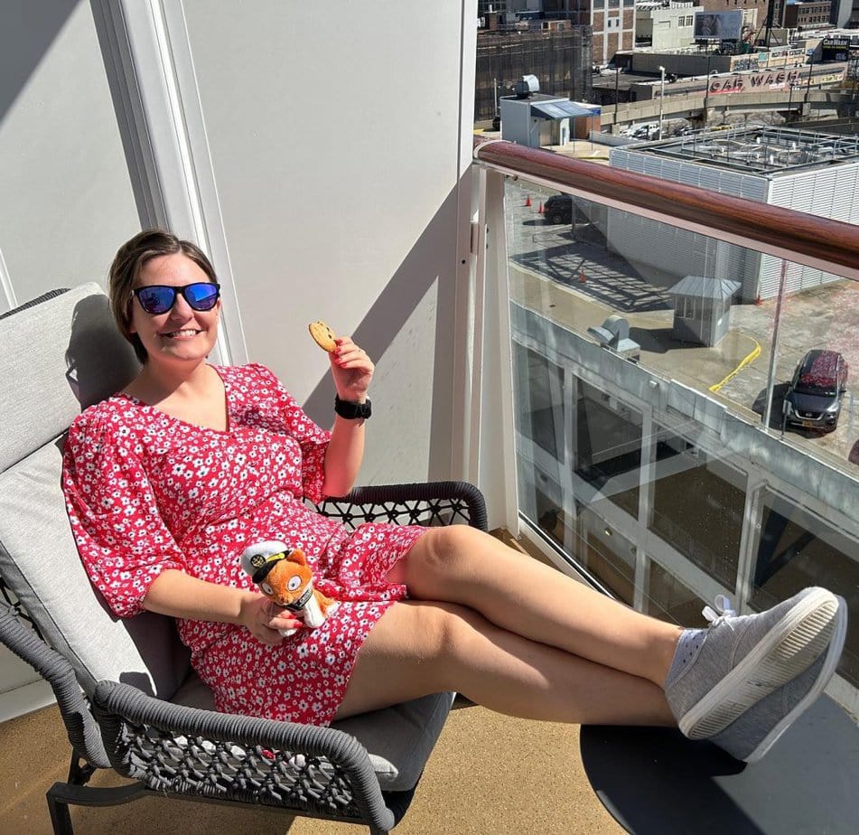 emma cruises red dress balcony cabin